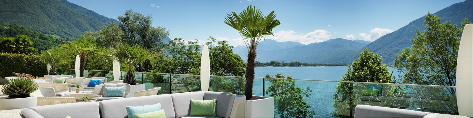 Image of lounge, overlooking lake and mountains